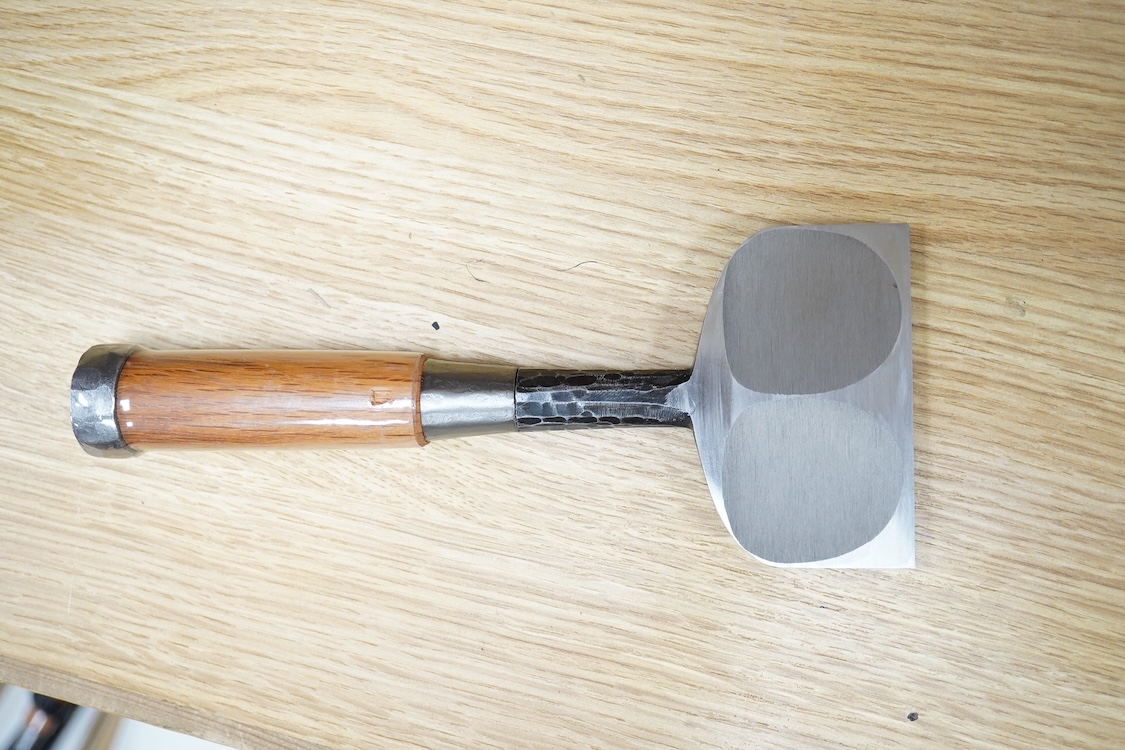 A collection of Japanese woodworking chisels and hammers, including; three boxed large mortise chisels, three boxed timber framing chisels (largest 90mm), and five heavy duty hammers/mallets (11)